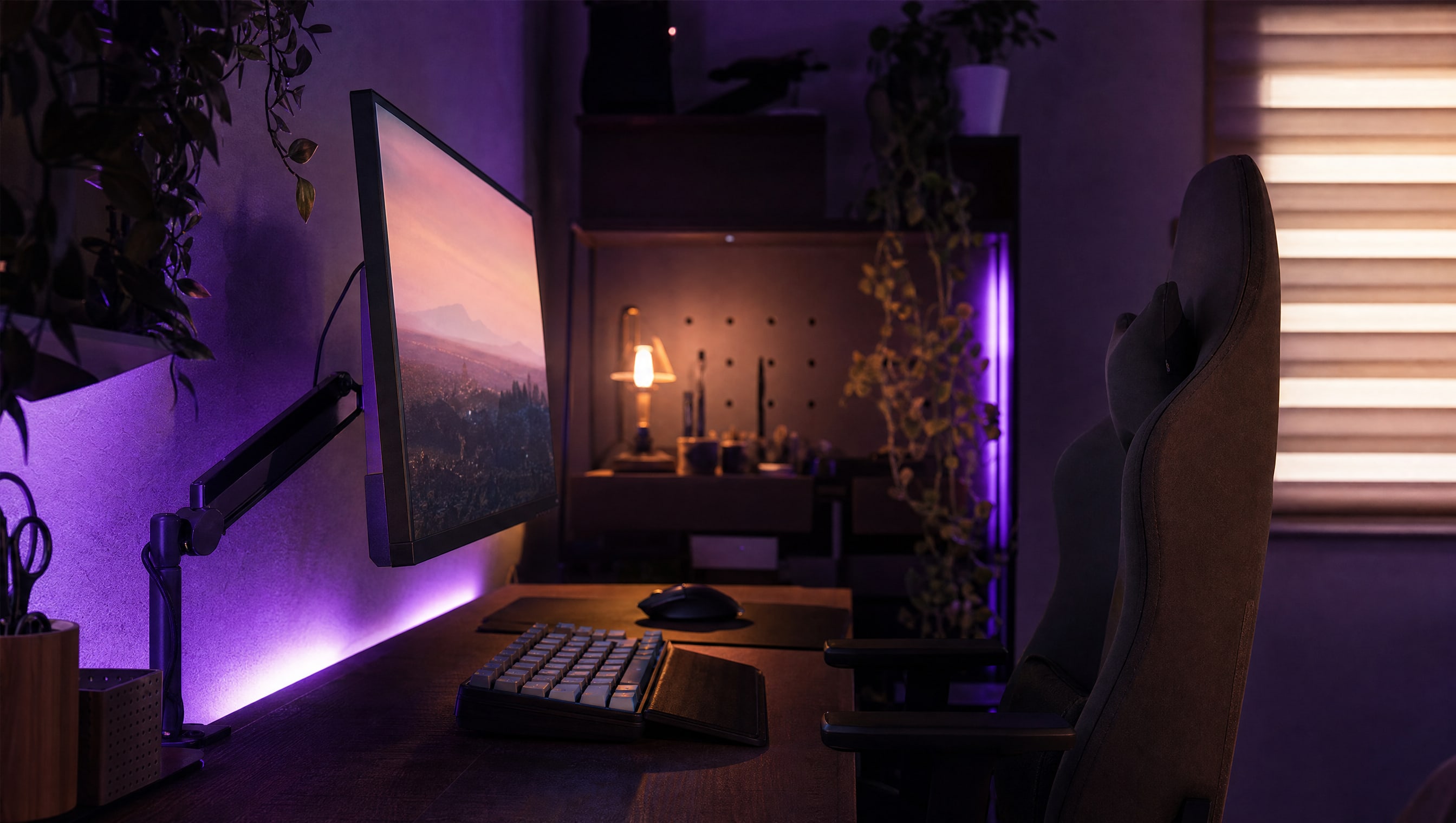 A chair and desk in side profile at seated height, the monitor raised to eye level.