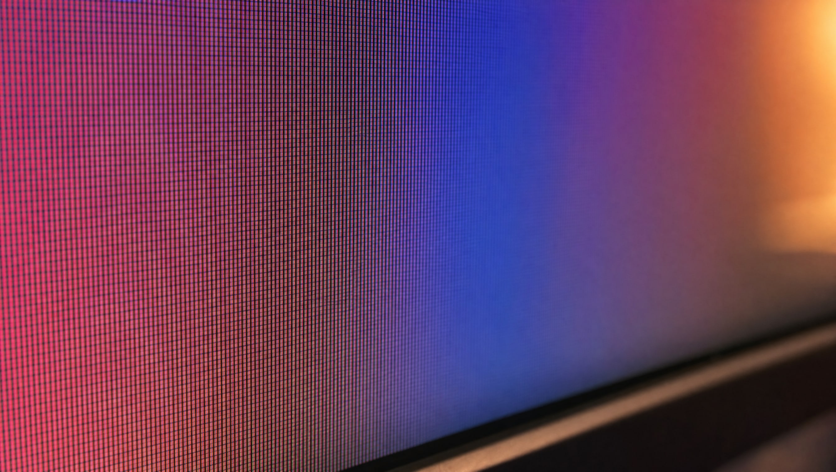 Extreme macro on a display panel surface where the pixel grid just resolves.
